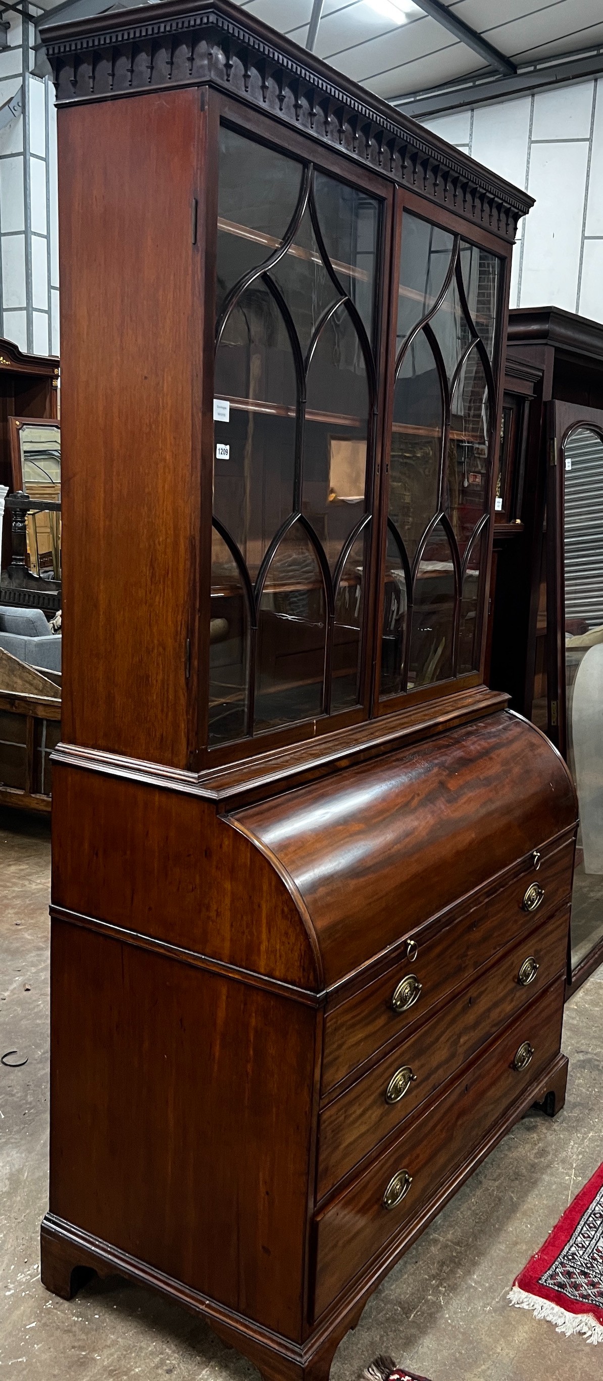 A George III mahogany cylinder bureau bookcase with glazed panelled doors, width 115cm, depth 60cm, height 227cm